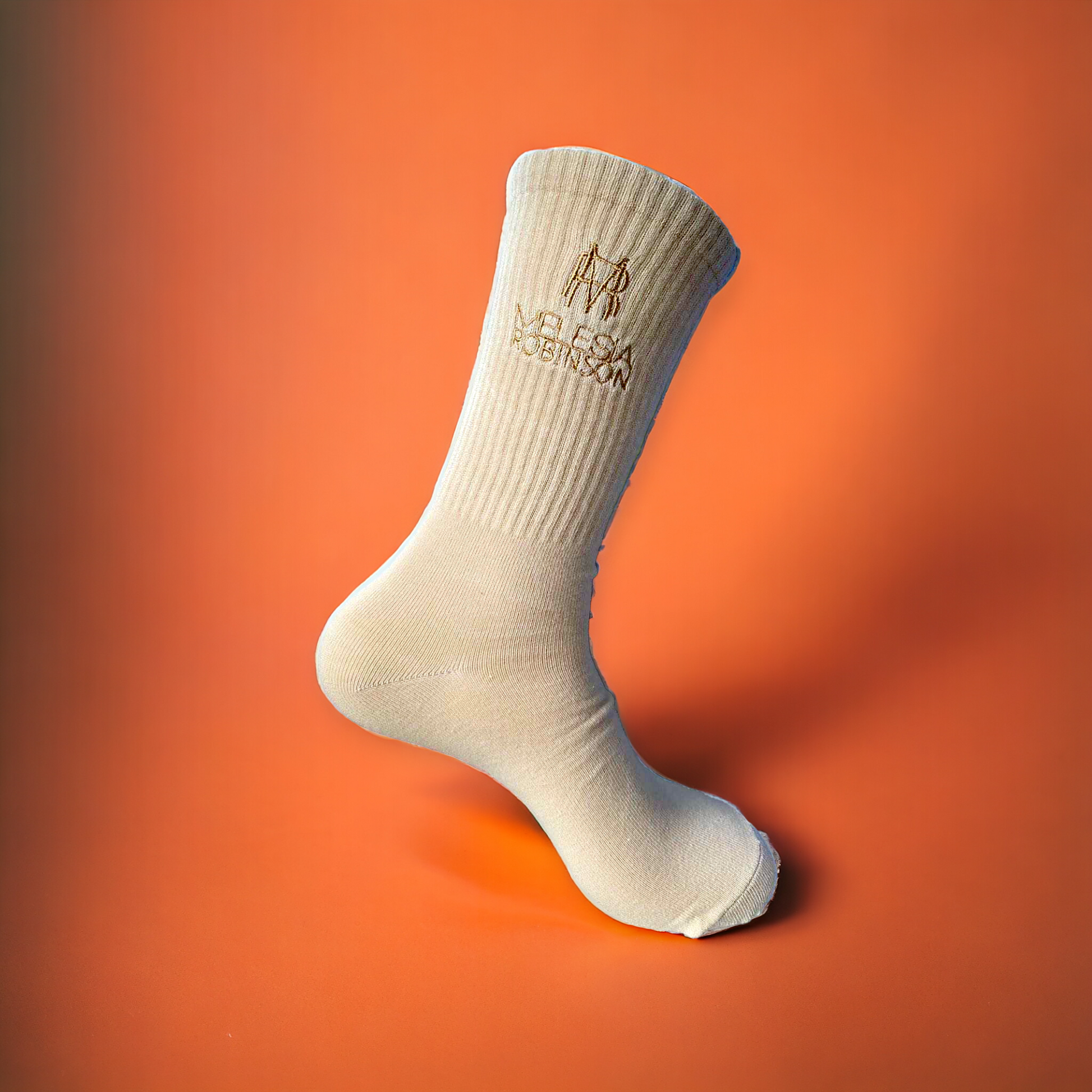 Calf-high knit stretch cotton-blend socks in beige. Logo embroidered at rib knit cuffs.