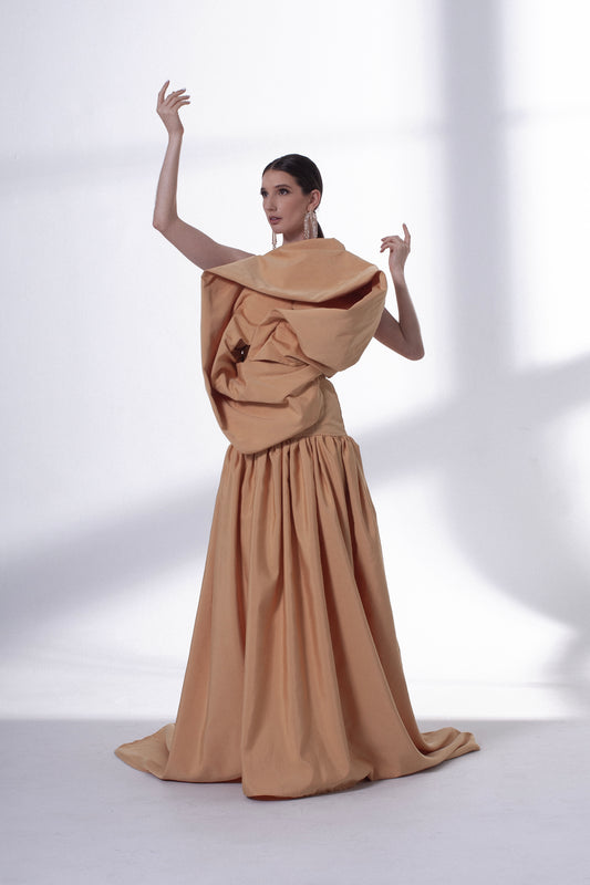 Wearing 'Champagne Dream' is not just donning a dress; it's embodying a sculptural vision. It's a celebration of fashion as a true art form. With this dress, you become a living canvas, a walking sculpture that captures the essence of elegance and innovation.